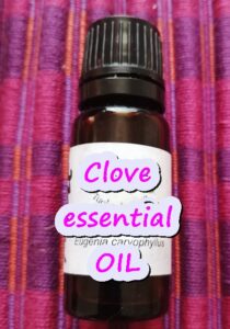 Clove essential oil sa brown bottle.